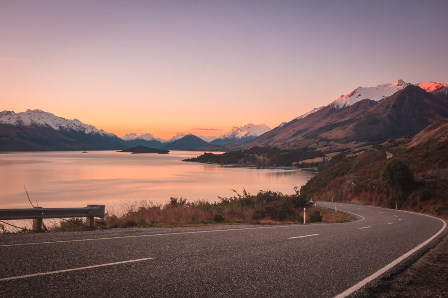 Looking across Lake Watatipu towards snowcapped mountains at sunset