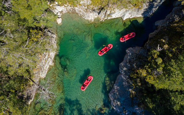 Aerial shot of Funyaks on the Dart River exploring the chasms