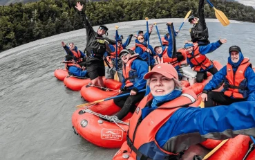 Funyak group and guides smiling in their funyaks on the river