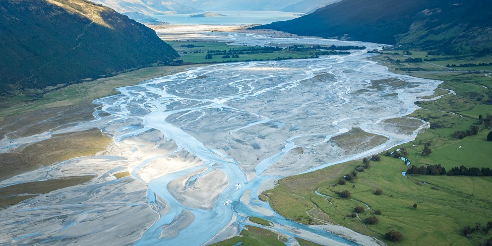 Braided river valley of Dart River framed by mountain ranges