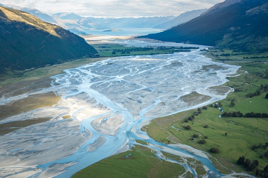 Braided river valley of Dart River framed by mountain ranges